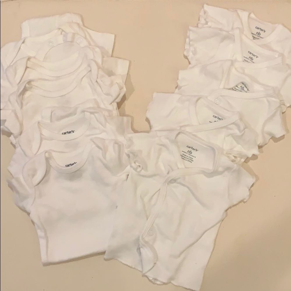 Lot of newborn white shirts and onesies